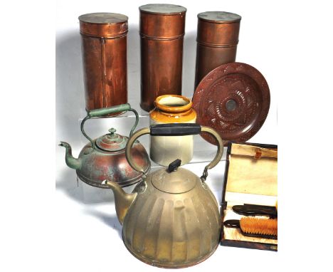 A box containing three copper canister containers, vintage hairbrush set and copper and brass kettles etc. 