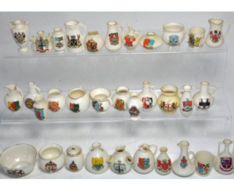 Approximately thirty pieces of Crested ware to include examples by W.H. Goss, and Locke & Co, Worcester.