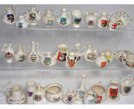 Approximately thirty pieces of crested ware to include W.H. Goss and Carlton china examples.