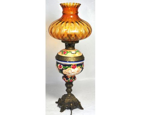 A reproduction 19th century oil lamp converted and now an electric lamp complete with shade and a decorative bowl, height 64c