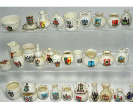Approximately thirty pieces of Crested ware to include examples by W.H. Goss, Carlton china and Victoria china.