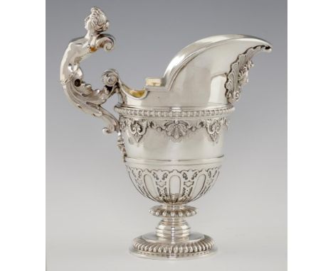 A VICTORIAN HELMET SHAPED SILVER EWER  with caryatid handle and cut card ornament, 31cm h, by R &amp; S Garrard &amp; Co, Lon