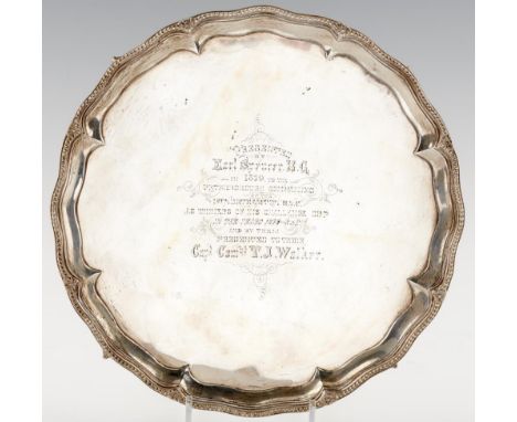 A GEORGE III SILVER SALVER  the beaded rim with paterae at intervals, on four claw and ball feet, engraved in 1879 with prese