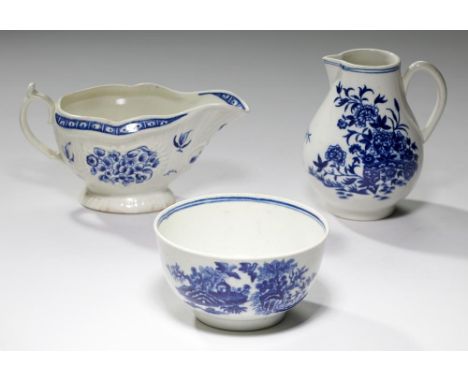 A WORCESTER BLUE AND WHITE  STRAP FLUTED SAUCE BOAT, C1770-80  painted with the associated Floral pattern, 16 cm l, open cres