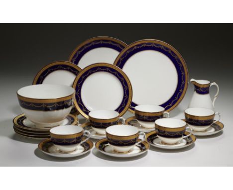 A ROYAL WORCESTER COBALT AND GILT FESTOON BORDERED TEA SERVICE, 1903-4  pair of plates 23cm diam, printed mark (22)++One of t