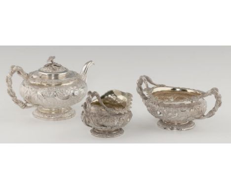 A FINE GEORGE IV COMPOSED  SILVER TEA SERVICE of heavy gauge, with entwined grapevine handles, the compressed body crisply ch