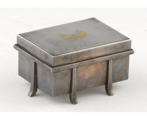 A JAPANESE SILVER AND GOLD INLAID BOX AND COVER IN THE FORM OF A KARABITSU, TAISHO PERIOD  11cm l, engraved signature, 14ozs 