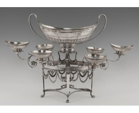 A GEORGE III NEO CLASSICAL SILVER EPERGNE  the eight pierced detachable navette shaped or round bowls on leaf wrapped cast sc