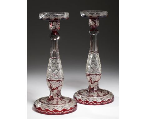 A PAIR OF RUBY FLASHED, ENGRAVED AND CUT GLASS CANDLESTICKS, EARLY 20TH C  33cm h++Good condition