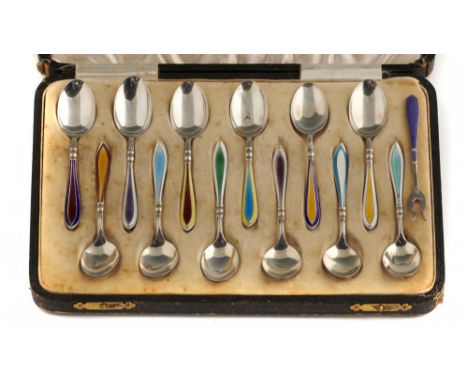 A SET OF TWELVE GEORGE V SILVER AND HARLEQUIN GUILLOCHE ENAMEL COFFEE SPOONS  by Barker Bros Silver Ltd, Birmingham 1932 and 