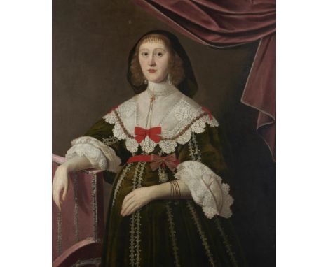 ATTRIBUTED TO EDWARD BOWER (1629-1667) PORTRAIT OF A LADY half length in a green dress and pearls, her right arm resting on a