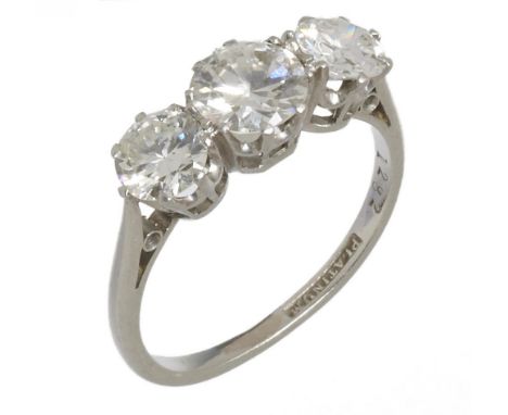 A THREE STONE DIAMOND RING the brilliant cut diamonds approx 1.8 ct, K colour, SI1 clarity, in platinum, 3g, size J++Hoop sho