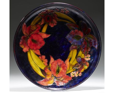 A MOORCROFT FLAMBE ORCHID BOWL, C1953-1960  31.5cm diam, impressed marks, painted signature, paper label++Light wear scratche