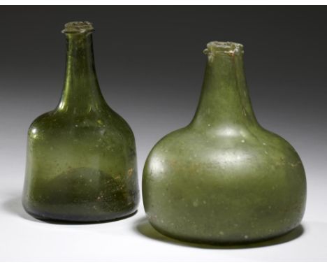 AN ENGLISH GLASS MALLET SHAPED BOTTLE, FIRST HALF 18TH C   16cm h and an English  glass onion bottle, early 18th c (2)++Malle