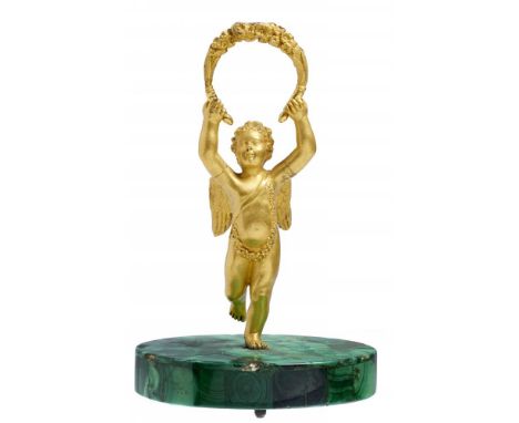 A CISELÉ AND GILT BRONZE MINIATURE STATUETTE OF PUTTO ON MALACHITE BASE, FRENCH OR RUSSIAN. EARLY/MID 19TH C 15cm h++Original