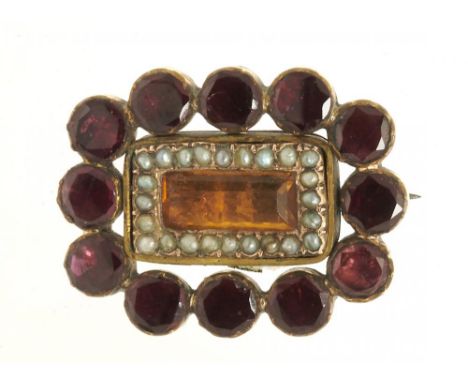 A GEORGIAN FLAT CUT GARNET AND SEED PEARL BROOCH with central foiled citrine, in gold, 2.2 cm long, 5g++In good condition, wi