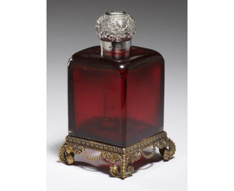 A VICTORIAN SILVER MOUNTED RUBY GLASS SCENT BOTTLE   on beaded brass base. faceted stopper, 13cm h,  mounted by Louis Augustu