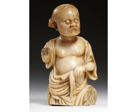 A CHINESE FINELY CARVED SOAPSTONE FIGURE OF LI TIEGUAI, 17TH/18TH C seated half length, his left hand holding his iron crutch