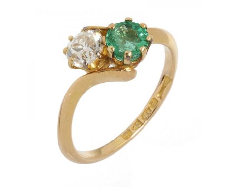 AN EMERALD AND OLD CUT DIAMOND TWIST RING the diamond approx 0.5 ct, emerald approx 0.6 ct, in 18ct gold, Chester 1901, 4g, s