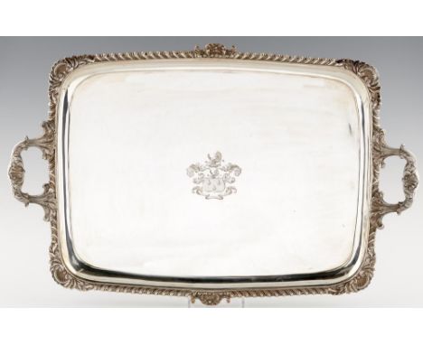 A FINE IRISH GEORGE IV GADROONED SILVER TEA TRAY  engraved with armorials, 75cm l, by James Le Bass, Dublin 1825, 175ozs The 