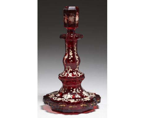 A BOHEMIAN ENAMELLED RUBY GLASS SCENT BOTTLE AND A STOPPER, C1860 with white enamel and gilt foliage, 21cm h++One or two pinh