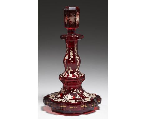 A BOHEMIAN ENAMELLED RUBY GLASS SCENT BOTTLE AND A STOPPER, C1860 with white enamel and gilt foliage, 21cm h++One or two pinh