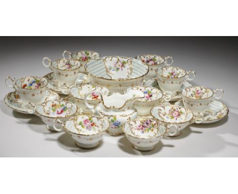A COALPORT TEA AND COFFEE SERVICE, C1835 of Adelaide shape, painted with flowers in lightly moulded gilt borders alternating 