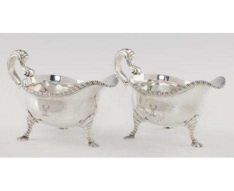 A PAIR OF GEORGE III GADROONED SILVER SAUCE BOATS  crested, 20cm l, by John Pollock, London 1779, 29ozs 4dwts++Good quality s