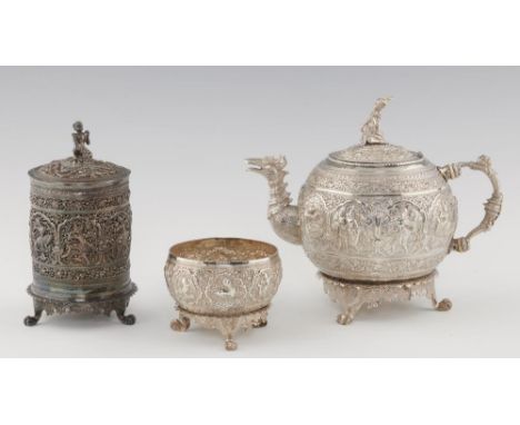 AN EXTRAORDINARY AND HEAVY BURMESE GLOBULAR SILVER TEAPOT, SUGAR BOWL AND BETEL BOX AND COVER, MYANMAR, C1900  the teapot wit