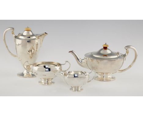 A  GEORGE V SHIELD SHAPED SILVER TEA SERVICE  with bifurcated handles,   teapot 13cm h, by Edward Barnard &amp; Sons Ltd, Lon