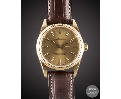 A GENTLEMAN'S 18K SOLID YELLOW GOLD ROLEX OYSTER PERPETUAL WRIST WATCH
CIRCA 1992, REF. 14238 WITH CHAMPAGNE DIAL
Movement:&n