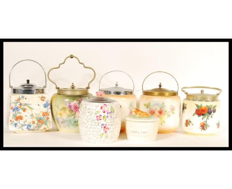 A collection of ceramic biscuit barrels dating from the early 20th Century to include mostly ivory blush examples with Art De