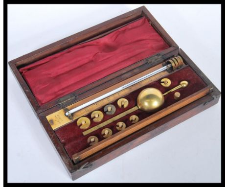 An early 20th Century Edwardian Sikes Hydrometer, possibly for use within a Dairy, the mahogany case with inset signed paper 