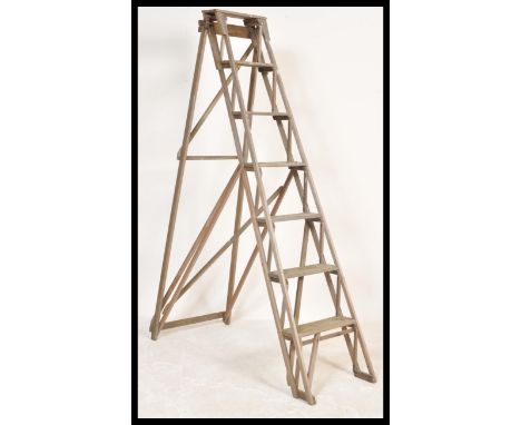 A vintage retro 20th Century Jones Patent ladder of lattice form having graduating steps. Makers plaque to side. Measures 177