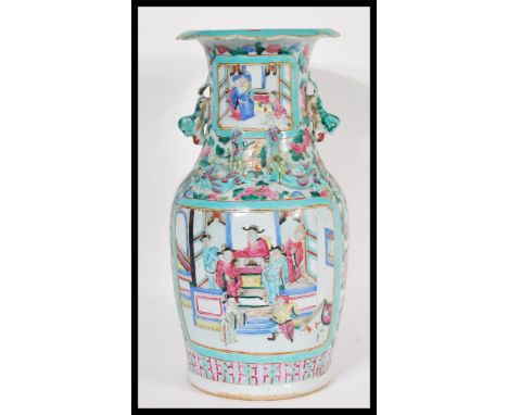 A 18th / 19th Century Chinese porcelain vase having turquoise ground with white cartouche panels depicting court scenes and f