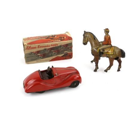 Schuco Examico 4001 car in box and a tin plate clockwork horse and jockey, made in Germany, marked K 900. (2)