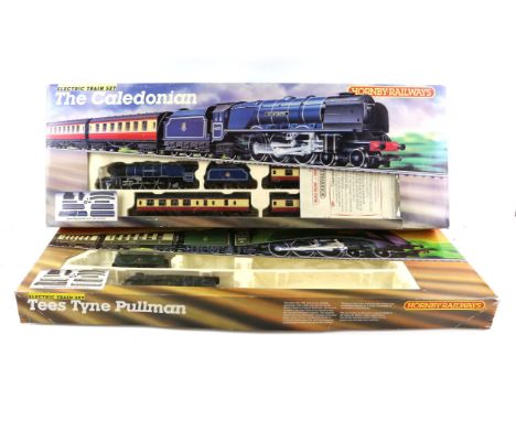 4 boxed train sets including Hornby The Caledonian, Tees Tyne Pullman, Dapol Traditional DC Train Set, Lima GWR Branch Passen