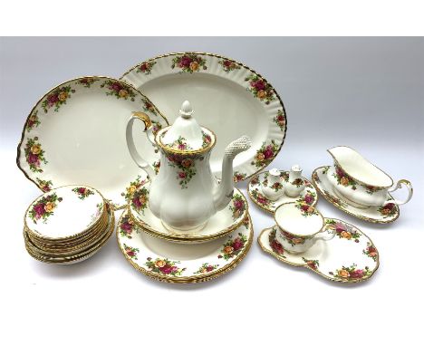 Royal Albert Country Roses part dinner service comprising a coffee pot, three dinner plates, two oval bowls, six breakfast bo