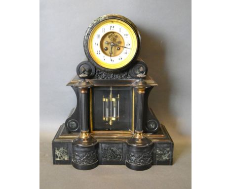A Victorian Black Slate and Marble Drum Shaped Mantel Clock, the visible escapement with enamel dial and Arabic numerals and 