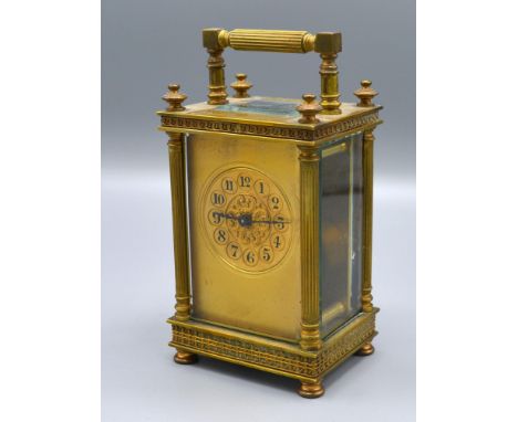 A 19th Century French Brass Cased Carriage Clock, the dial with Arabic numerals and with lever escapement and carrying handle