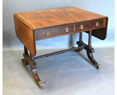 A 19th Century Mahogany Sofa Table, the moulded top above two frieze drawers opposed by dummy drawers raised upon twin end tu