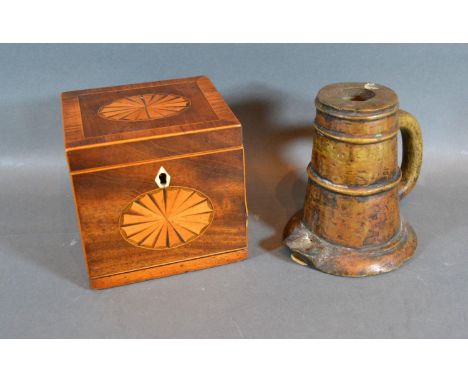 A 19th Century Mahogany Shell Inlaid Tea Caddy together with an early patinated bronze candlestick 