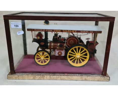 A plastic model of a steam engine in glass display case, 'MUSEUM OF STEAM   TOM VARLEY   GISBURN 322'. 39cm lentgh, 19cm dept