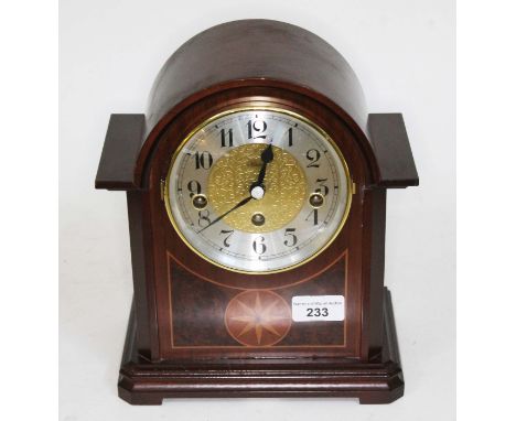 A reproduction Hermle mantle clock, height 26cm.  