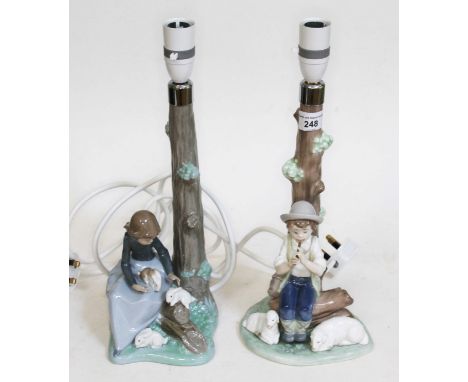 A pair of Nao figural lamps "Boy with sheep" and "Woodland friends", height 36cm.  No damages to any of the lamps.