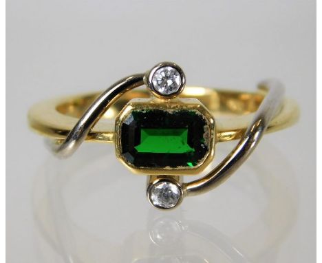 An 18ct gold ring set with green garnet and diamond 9.6g Size R