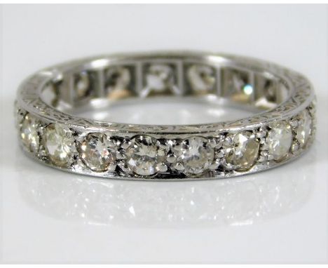 A platinum eternity ring with carved sides set approx 1ct diamonds 3.7g size K