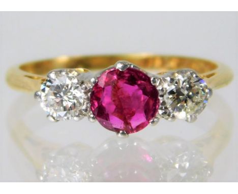An 18ct gold early 20th century platinum mounted 0.6ct diamond and ruby ring 2.9g size M