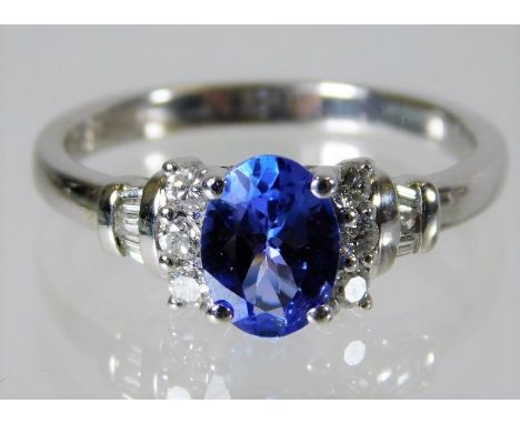 An 18ct white gold ring set with tanzanite and 0.2ct diamond 3.6g Size N