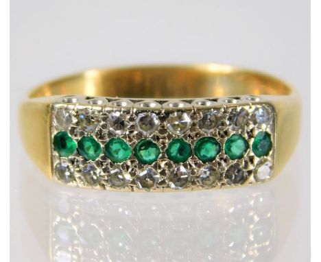An 18ct gold ring set with 0.33ct diamond and emeralds 5g Size T